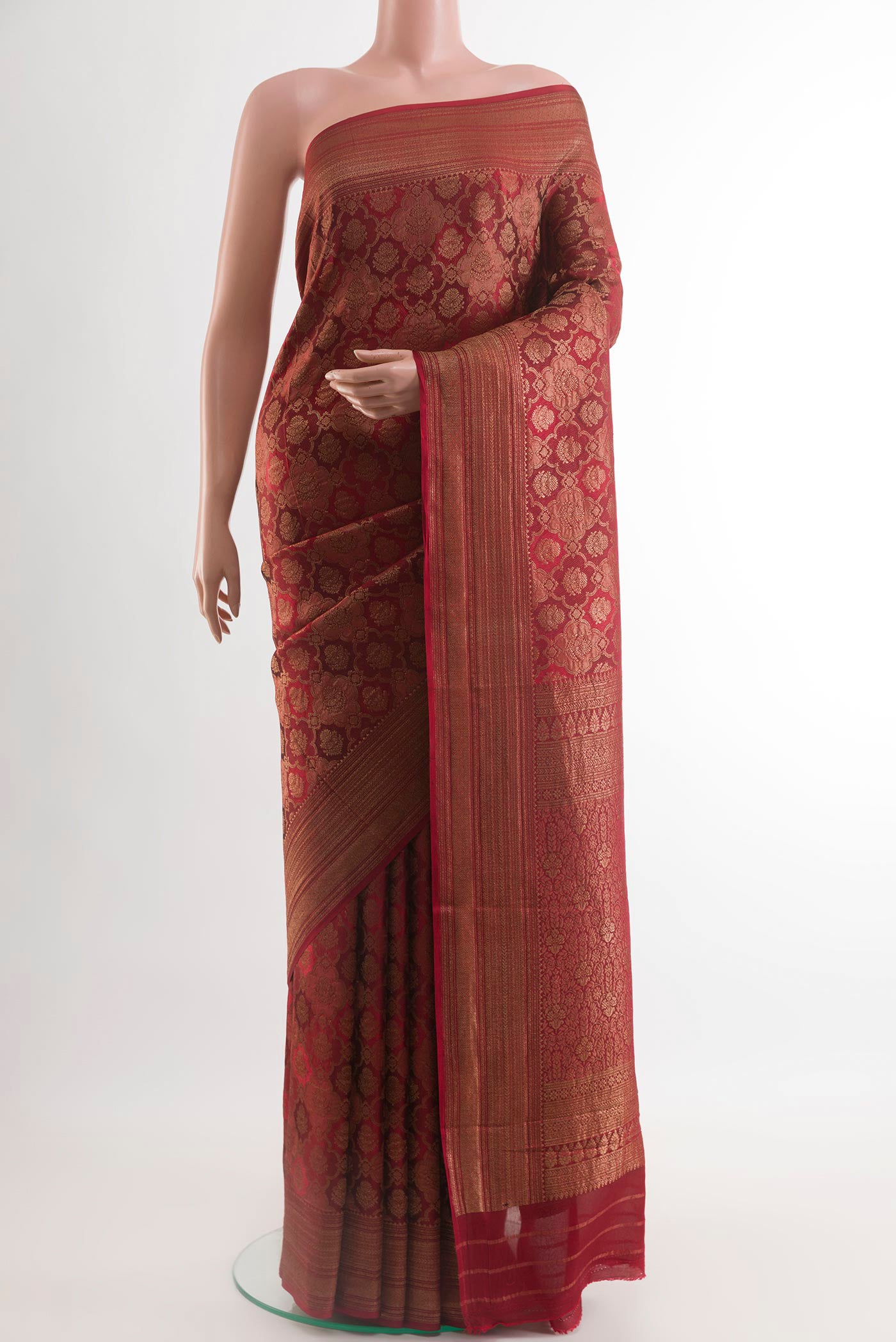 Red Mysore Crepe Saree with Zari Brocade on the body and Zari Border.  displayed on a mannequin