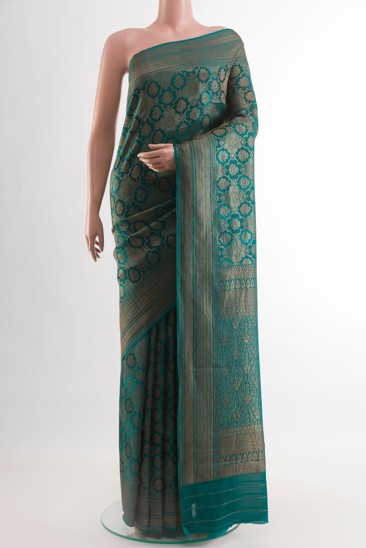 Sea Green Mysore Crepe Saree with Zari Brocade on the body and Zari Border.  displayed on a mannequin