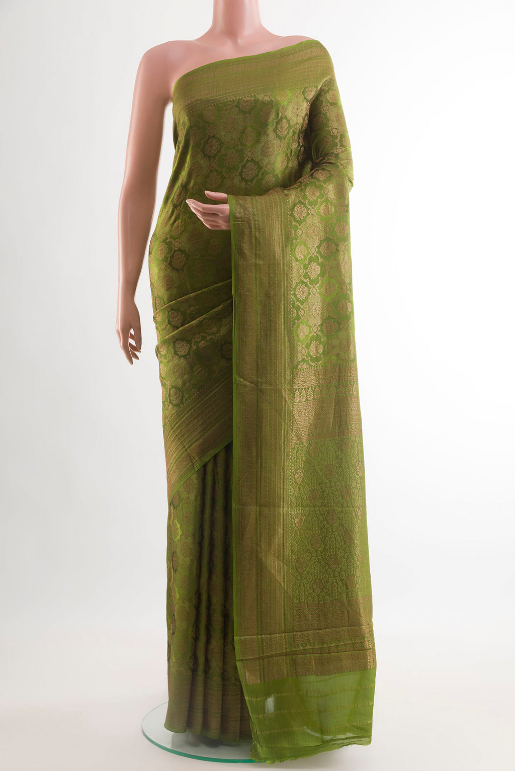 Green Mysore Crepe Saree with Zari Brocade on the body and Zari Border.  displayed on a mannequin