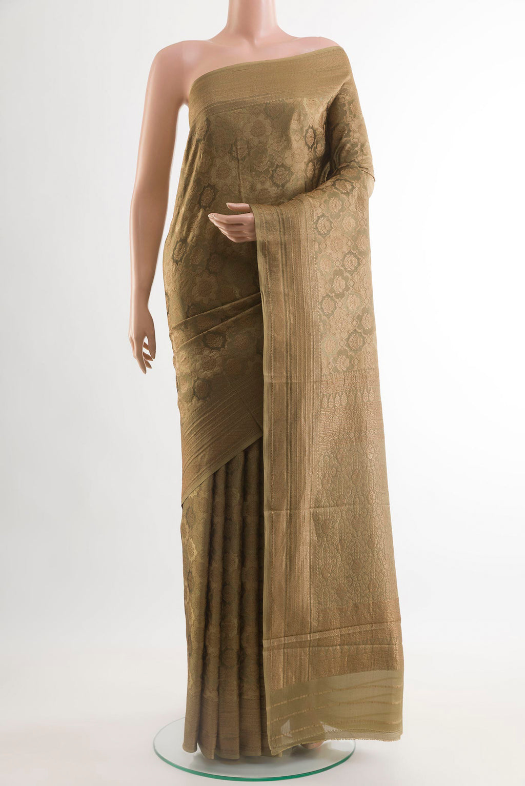 Beige Mysore Crepe Saree with Zari Brocade on the body and Zari Border.  displayed on a mannequin