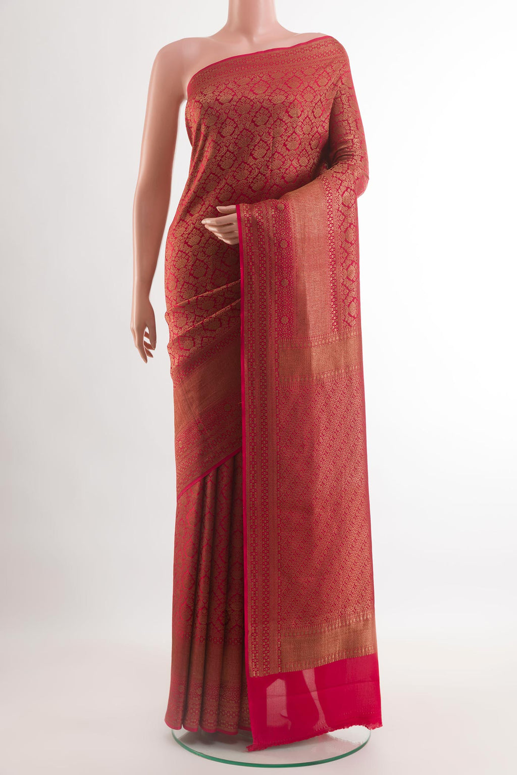 Red Mysore Crepe Saree with Zari Brocade on the body and Zari Border.  displayed on a mannequin