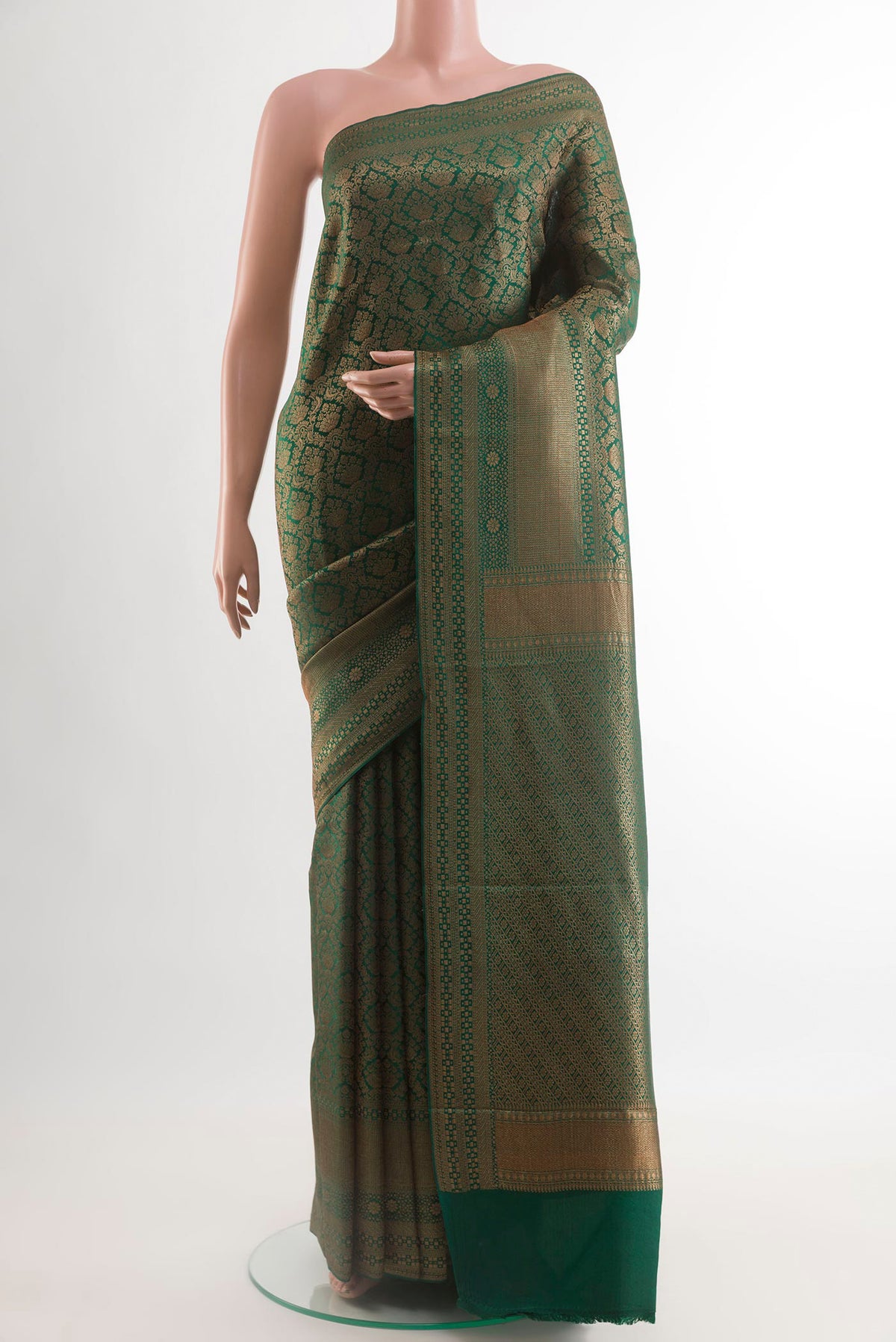 Green Mysore Crepe Saree with Zari Brocade on the body and Zari Border.  displayed on a mannequin