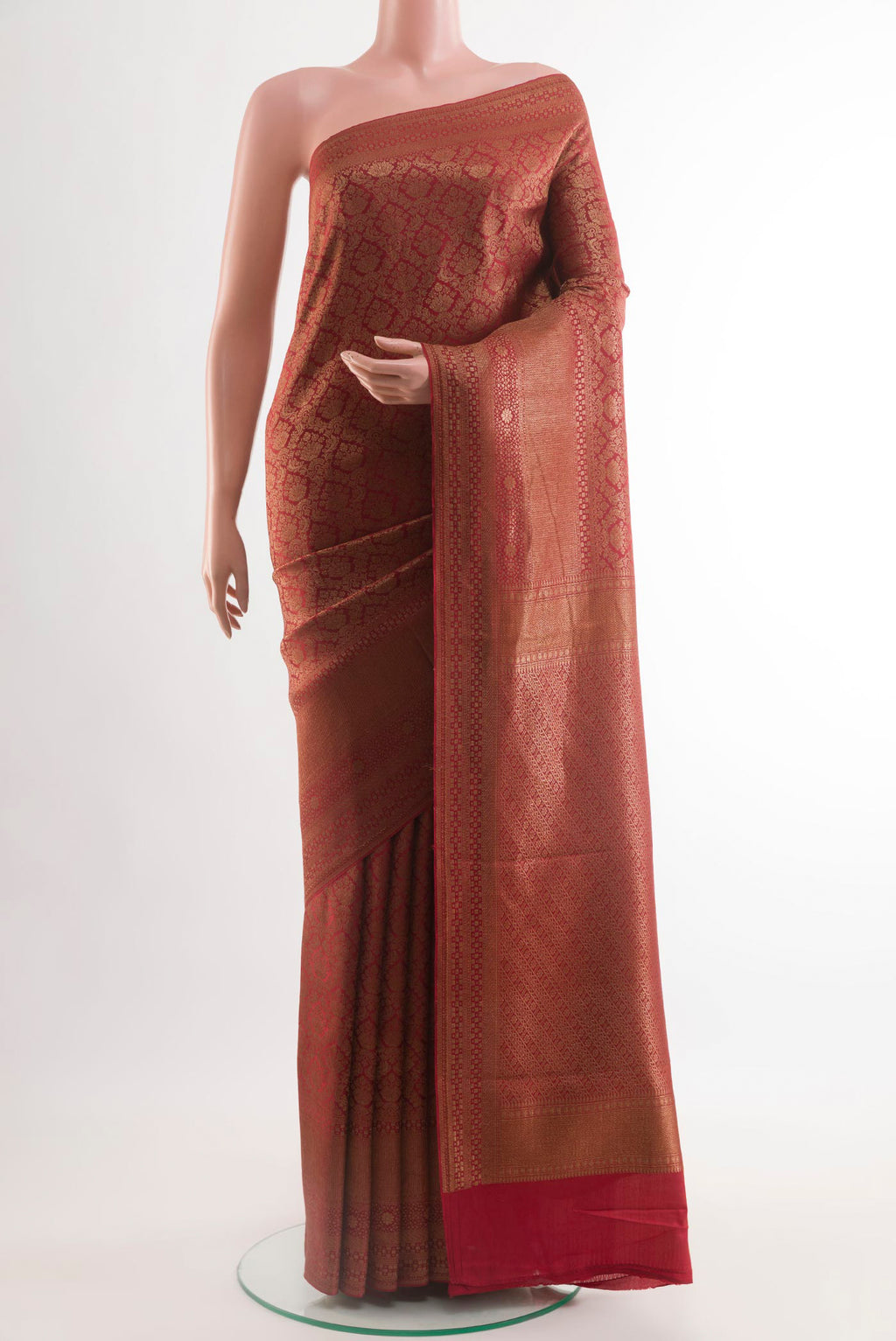 Red Mysore Crepe Saree with Zari Brocade on the body and Zari Border.  displayed on a mannequin