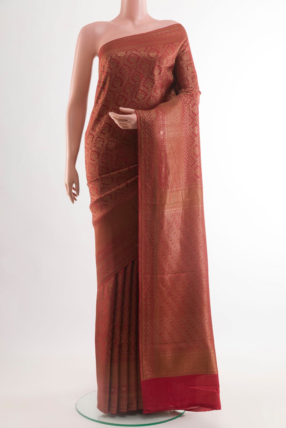Red Mysore Crepe Saree with Zari Brocade on the body and Zari Border.  displayed on a mannequin
