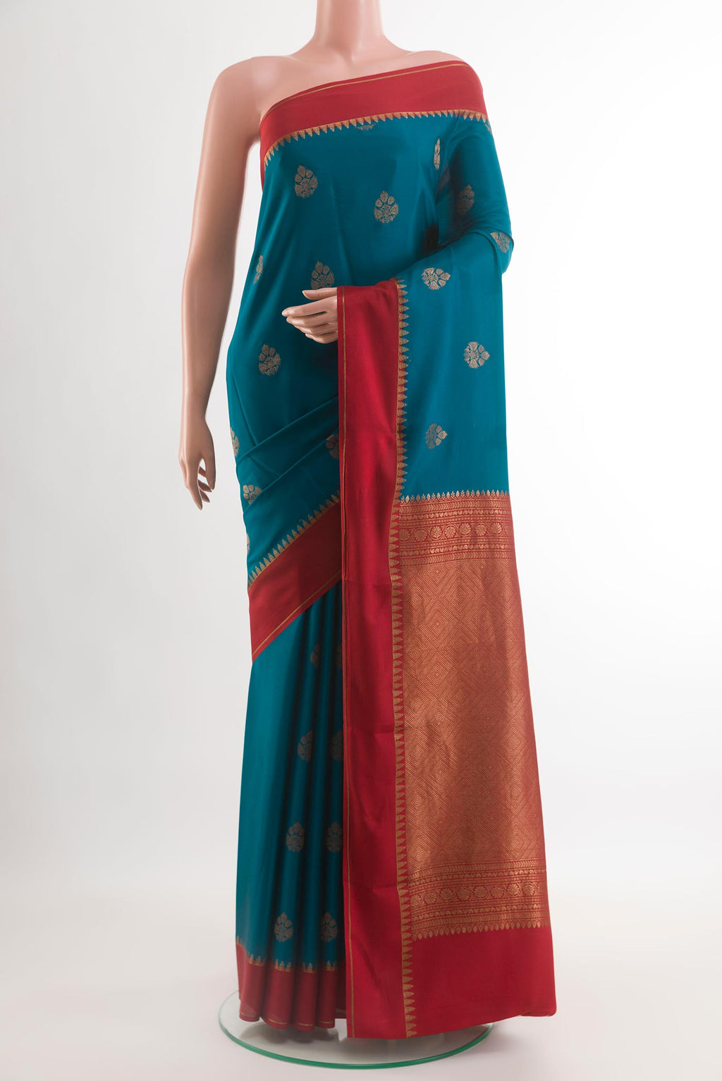 Blue Mysore Crepe Saree with Zari Butta on the body and Plain Border.  displayed on a mannequin