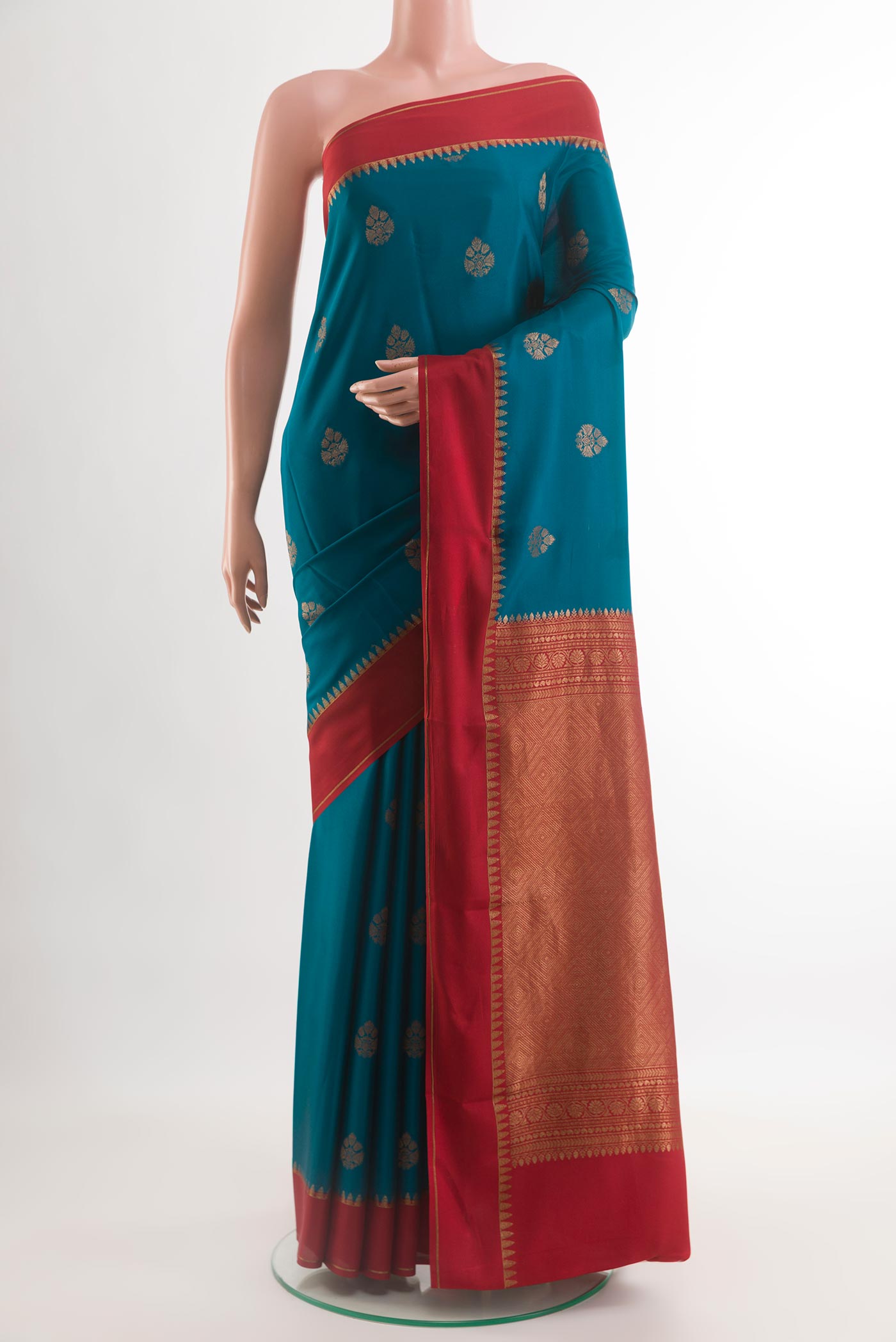 Blue Mysore Crepe Saree with Zari Butta on the body and Plain Border.  displayed on a mannequin