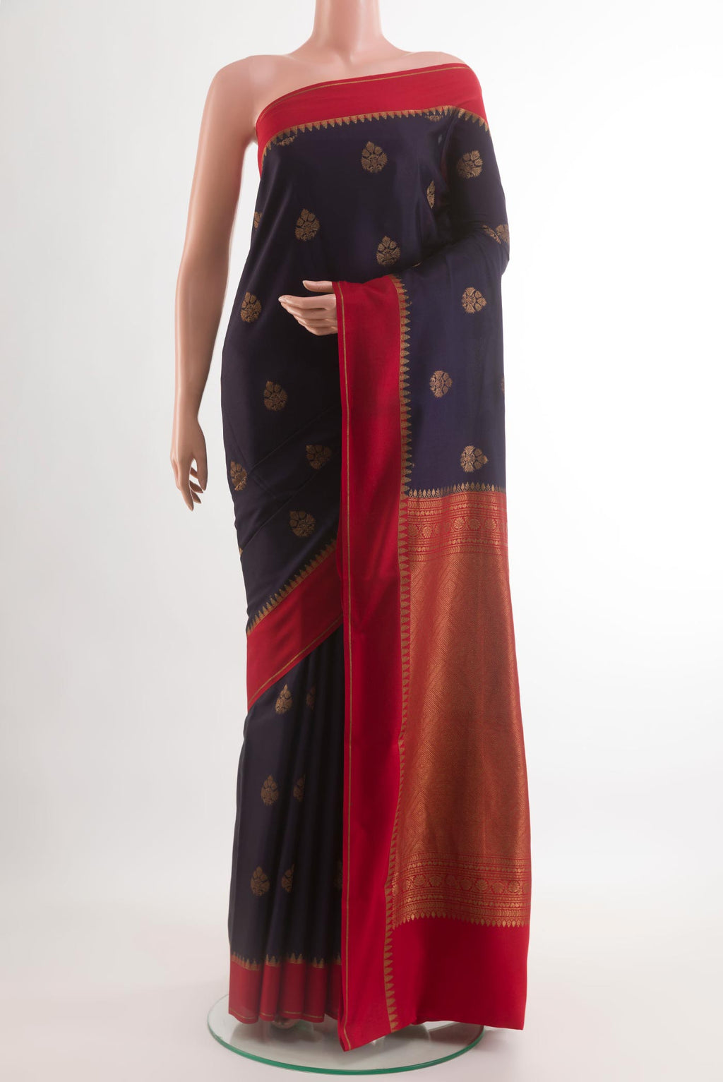 Navy Blue Mysore Crepe Saree with Zari Butta on the body and Zari Border.  displayed on a mannequin