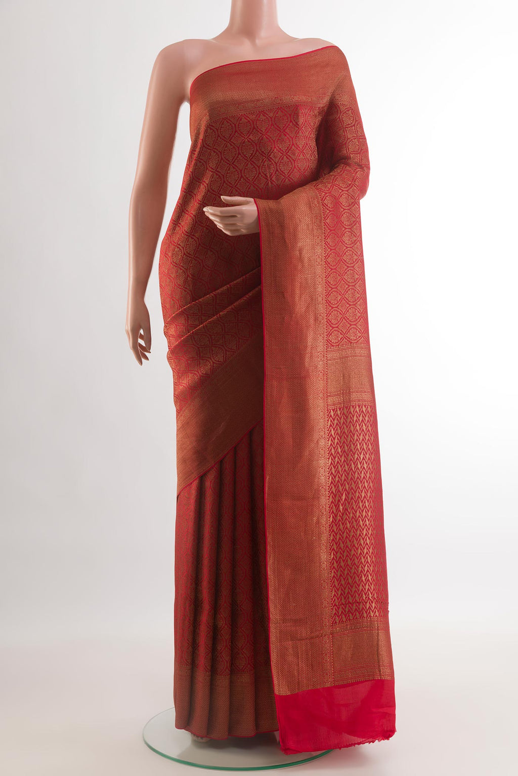 Red Mysore Crepe Saree with Zari Brocade on the body and Zari Border.  displayed on a mannequin