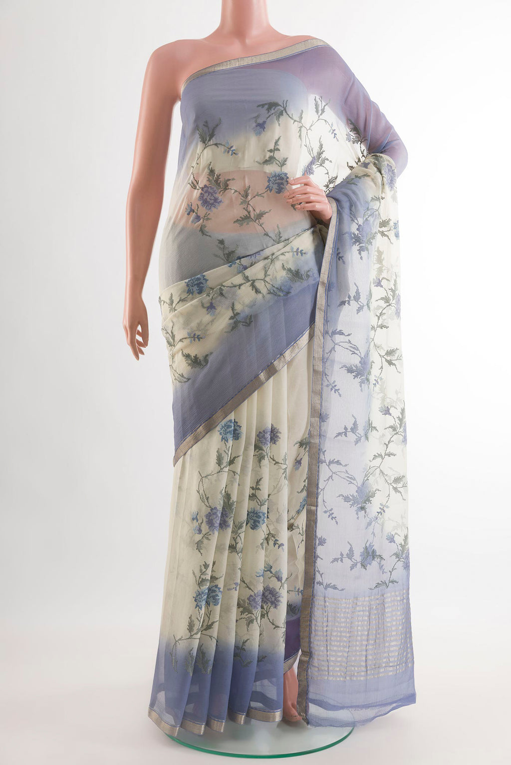 Off White Mysore Chiffon Saree with Embroidery on the body and Zari Border.  displayed on a mannequin