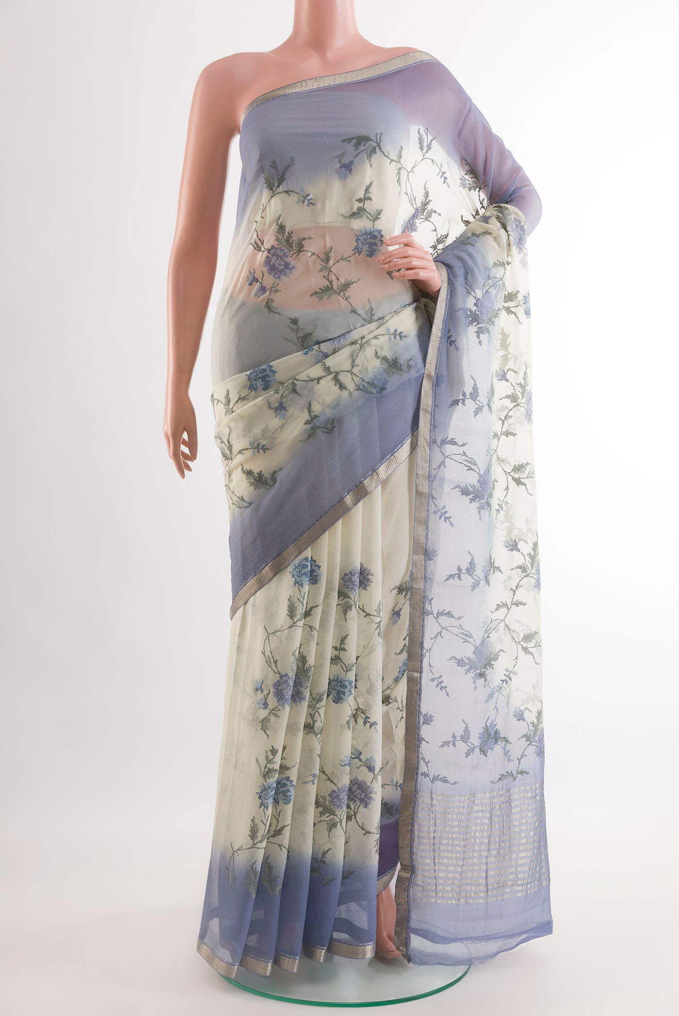 Off White Mysore Chiffon Saree with Embroidery on the body and Zari Border.  displayed on a mannequin