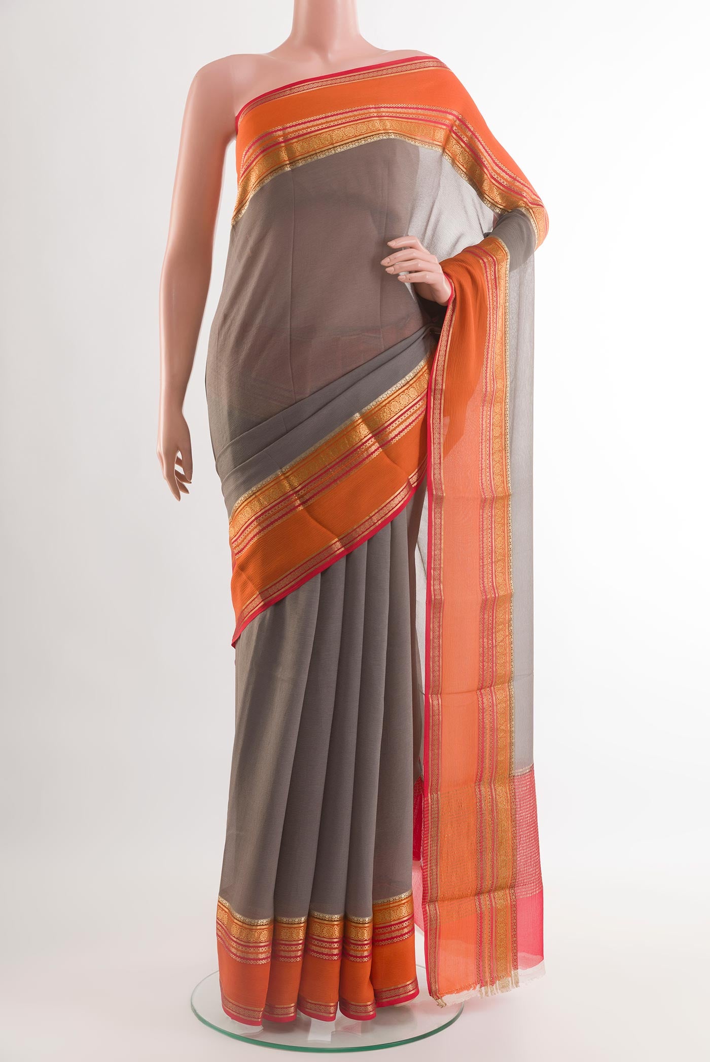 Grey Chiffon Saree with Plain Body and Plain Border.  displayed on a mannequin
