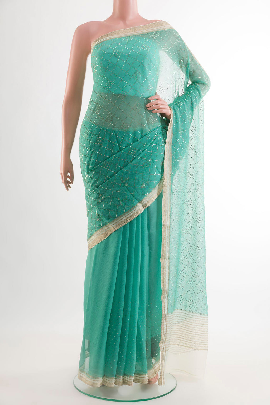 Turquoise Mysore Chiffon Saree with Embroidery on the body and Zari Border.  displayed on a mannequin
