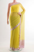 Lemon Yellow Mysore Chiffon Saree with Embroidery on the body and Zari Border.  displayed on a mannequin