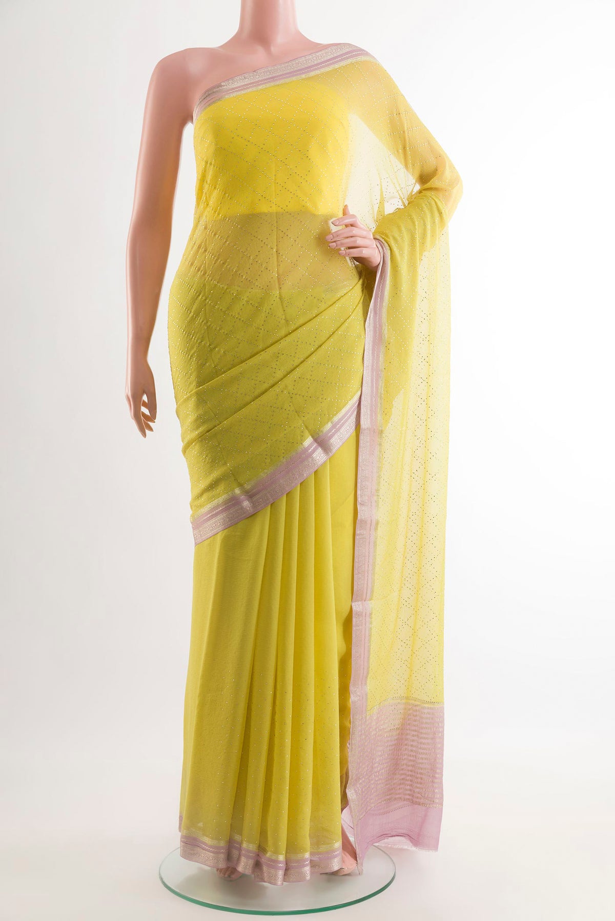 Lemon Yellow Mysore Chiffon Saree with Embroidery on the body and Zari Border.  displayed on a mannequin