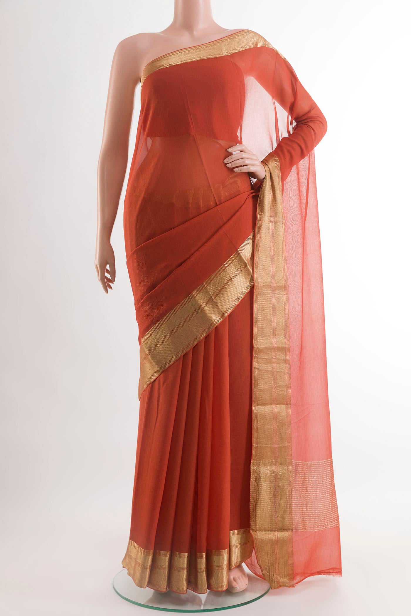 Orange Mysore Chiffon Saree with Plain Body and Zari Border.  displayed on a mannequin