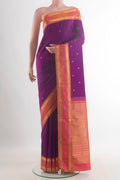 Pure Silk Purple Kanjivaram Saree with Zari Butta on the body and Zari Border.  displayed on a mannequin