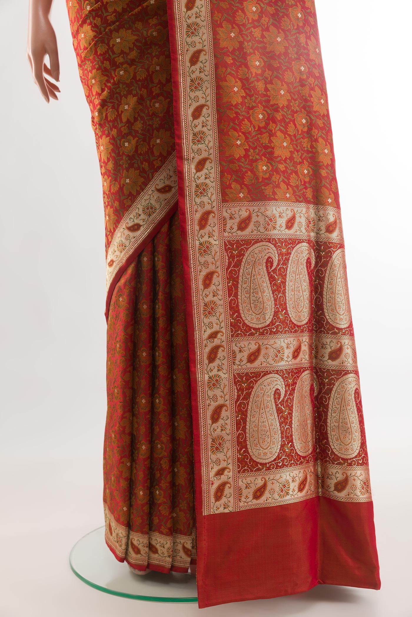 Pleats and pallu of Red Banarasi Tanchoi Silk Saree with Jacquard With Zari Butta on the body and Zari Border. 