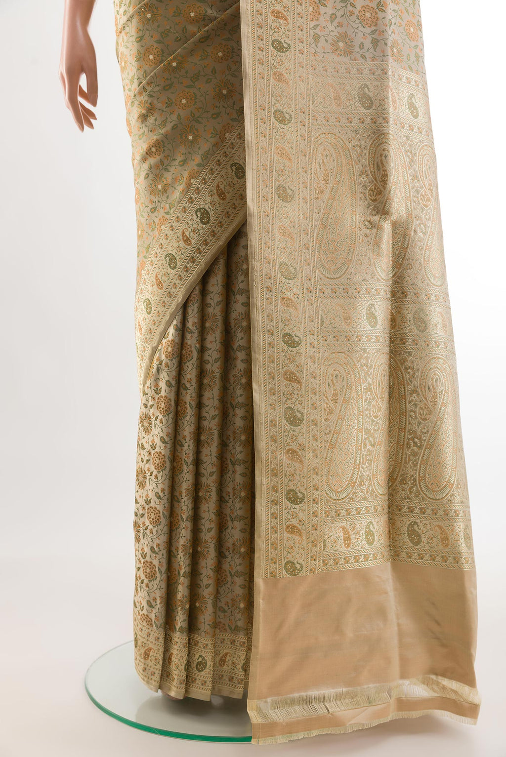 Pleats and pallu of Beige Banarasi Tanchoi Silk Saree with Jacquard With Zari Butta on the body and Zari Border. 