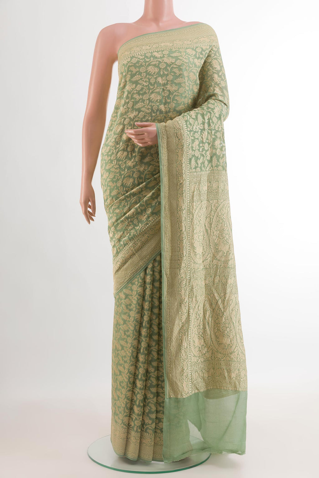 Light Green Banarasi Georgette Saree with Zari Brocade on the body and Zari Border.  displayed on a mannequin