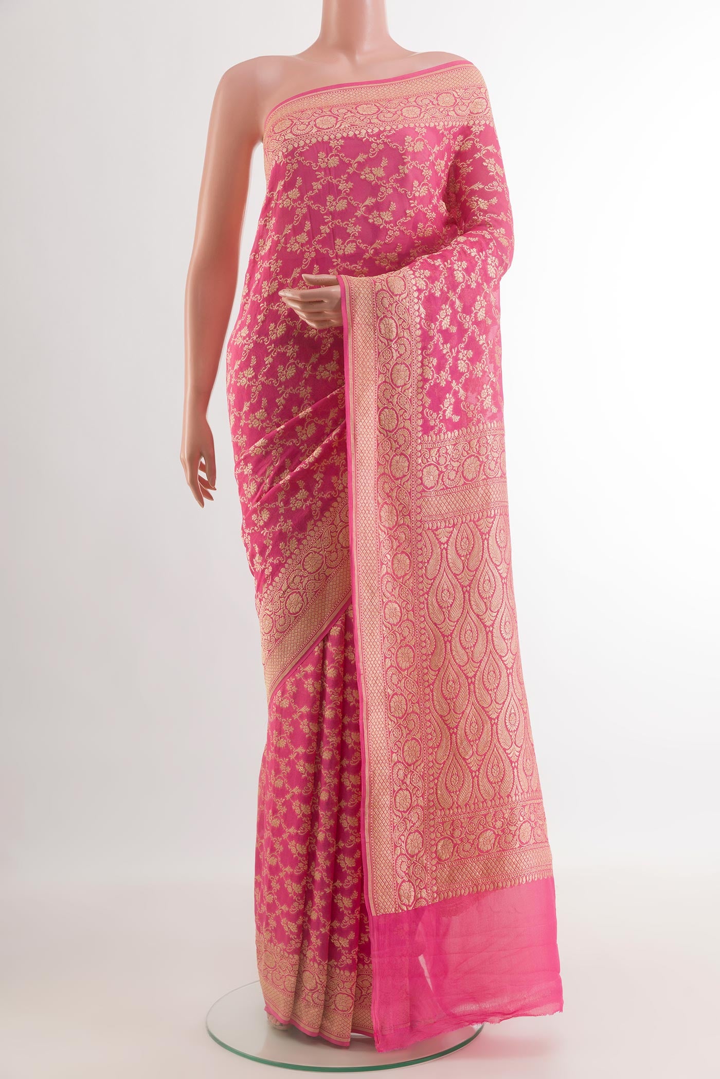 Pink Banarasi Georgette Saree with Zari Brocade on the body and Zari Border.  displayed on a mannequin