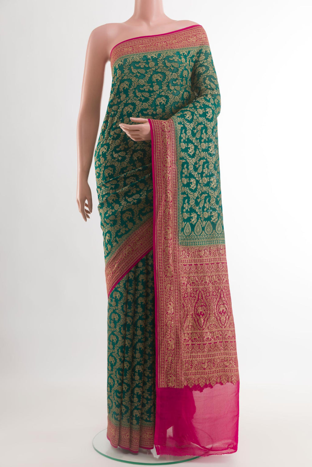 Green Banarasi Georgette Saree with Zari Brocade on the body and Zari Border.  displayed on a mannequin