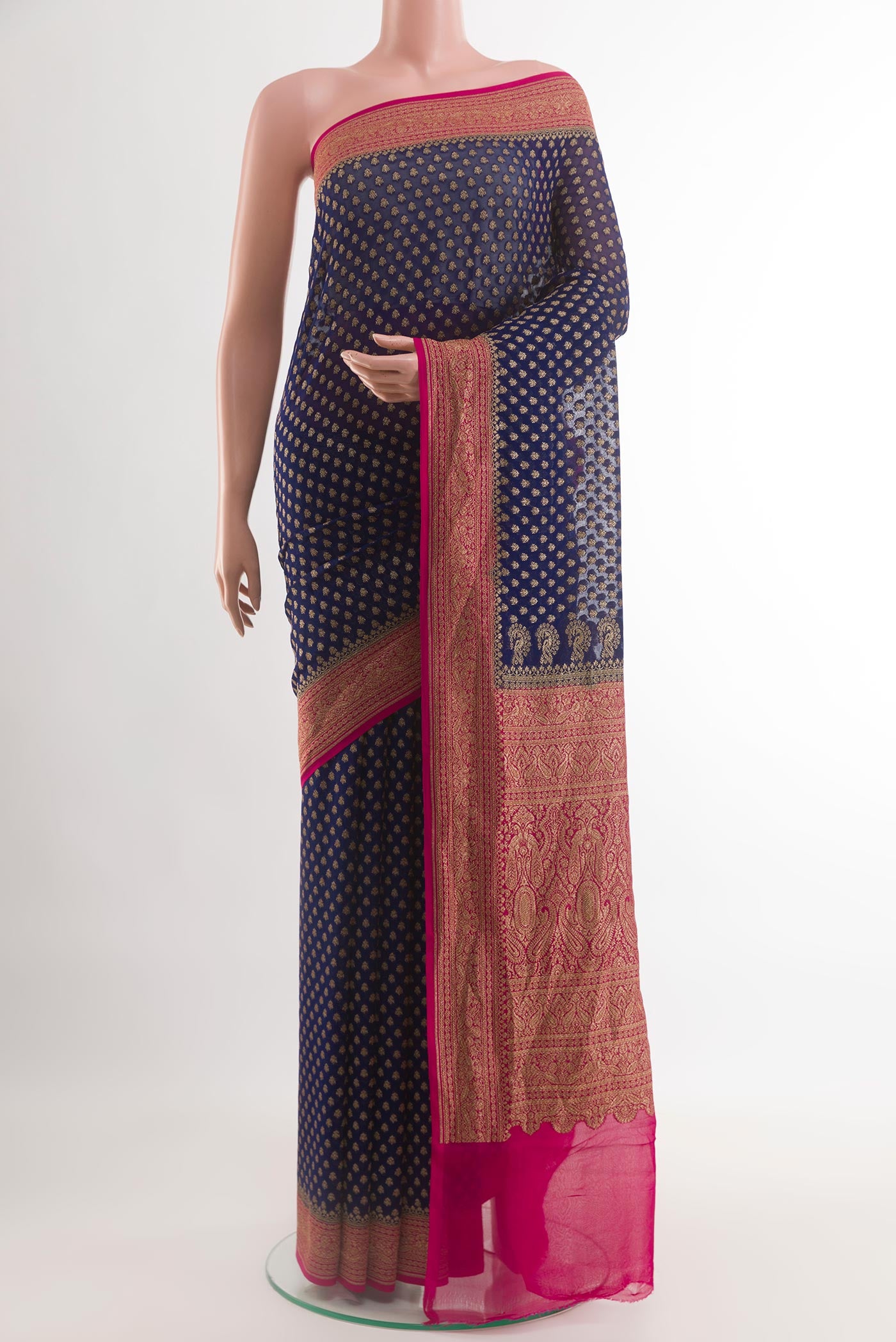 Navy Blue Banarasi Georgette Saree with Zari Butta on the body and Zari Border.  displayed on a mannequin