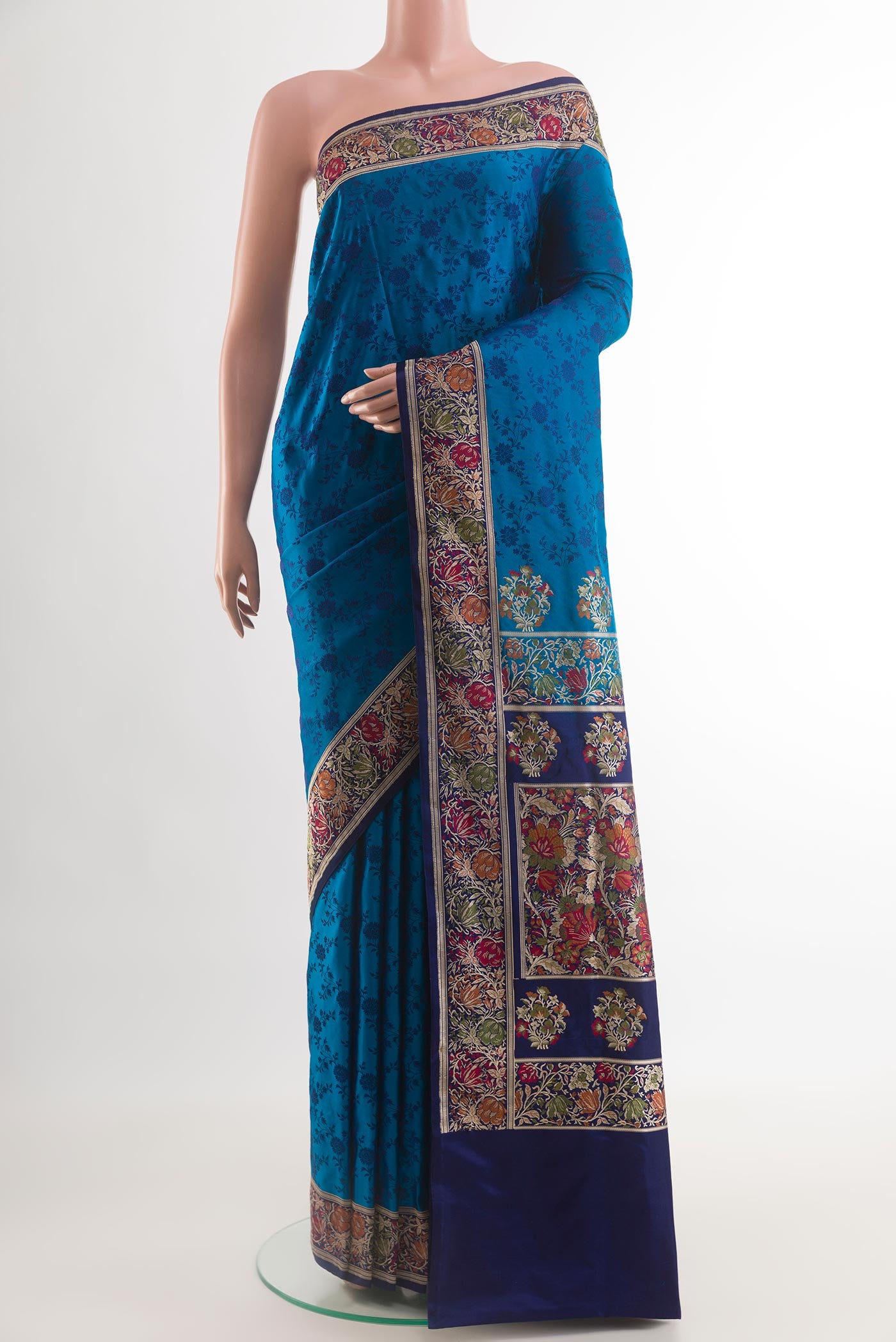 Blue Banarasi Tanchoi Silk Saree with Jacquard design on the body and Zari And Thread Border.  displayed on a mannequin