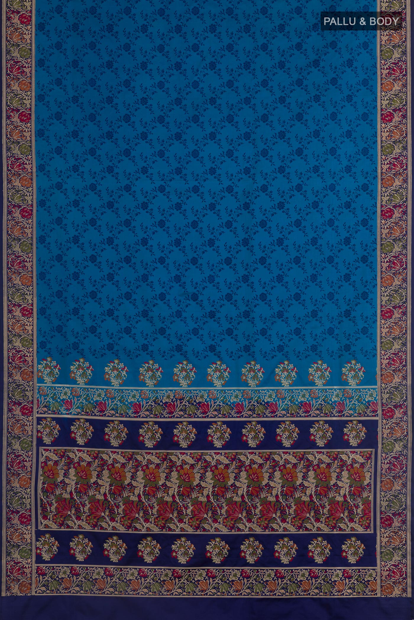 Flat view of Blue Banarasi Tanchoi Silk Saree with Jacquard design on the body and Zari And Thread Border. 
