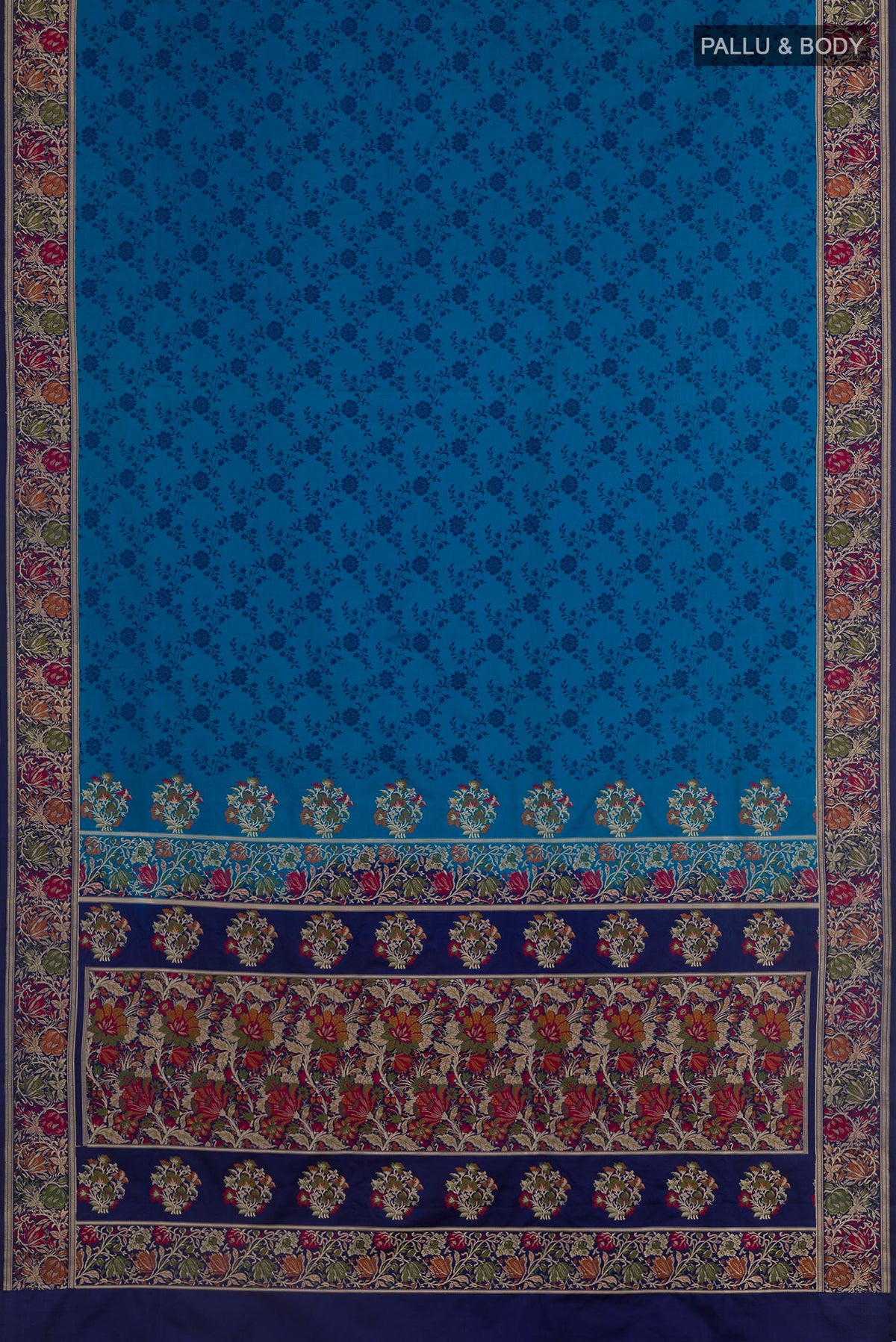 Flat view of Blue Banarasi Tanchoi Silk Saree with Jacquard design on the body and Zari And Thread Border. 