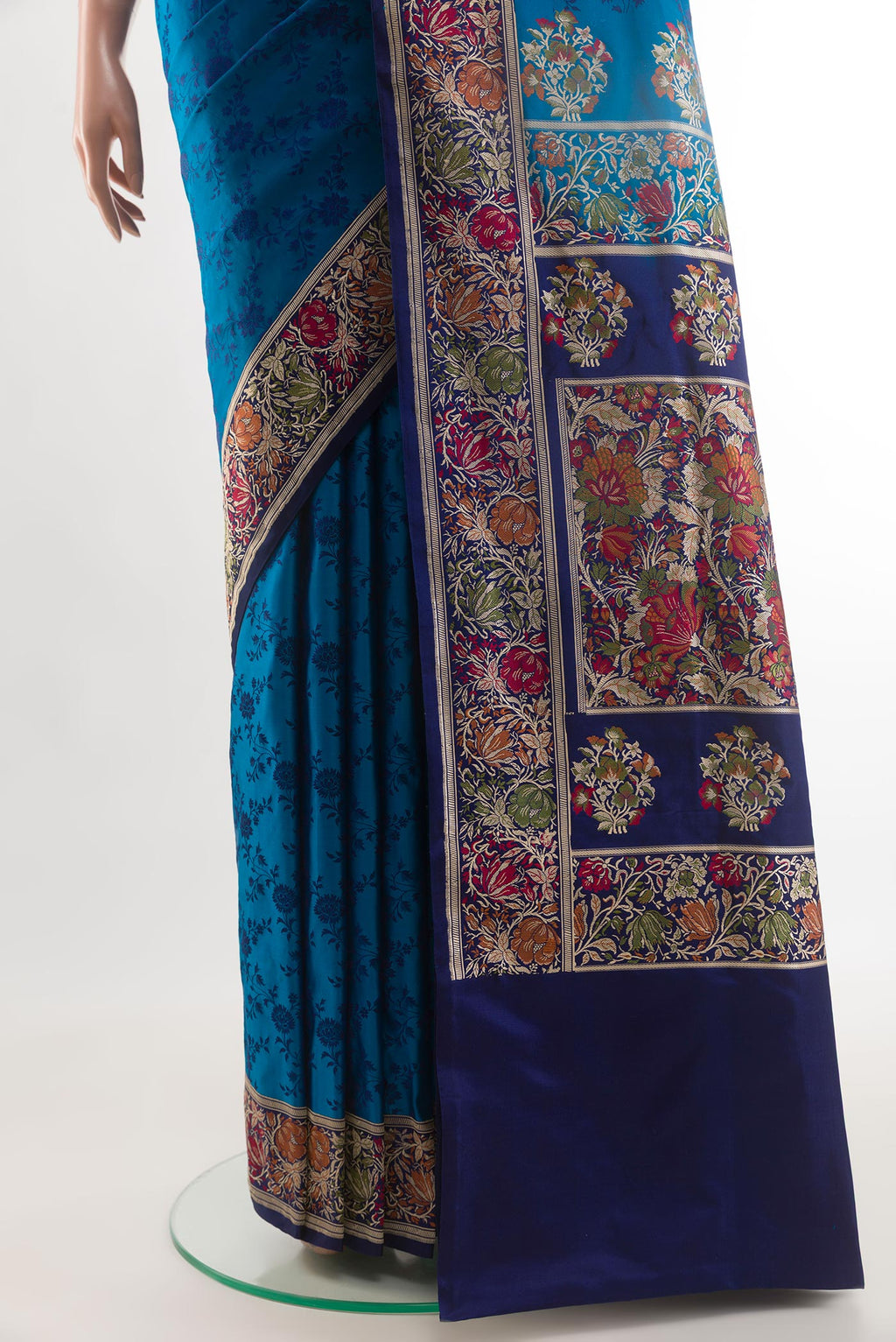 Pleats and pallu of Blue Banarasi Tanchoi Silk Saree with Jacquard design on the body and Zari And Thread Border. 