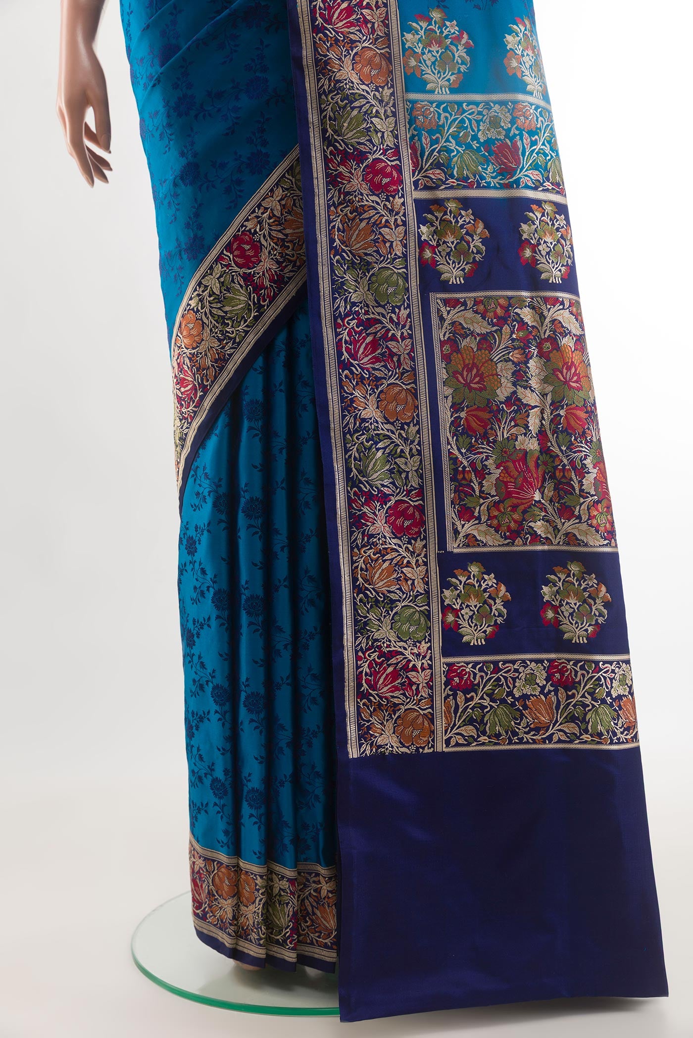 Pleats and pallu of Blue Banarasi Tanchoi Silk Saree with Jacquard design on the body and Zari And Thread Border. 