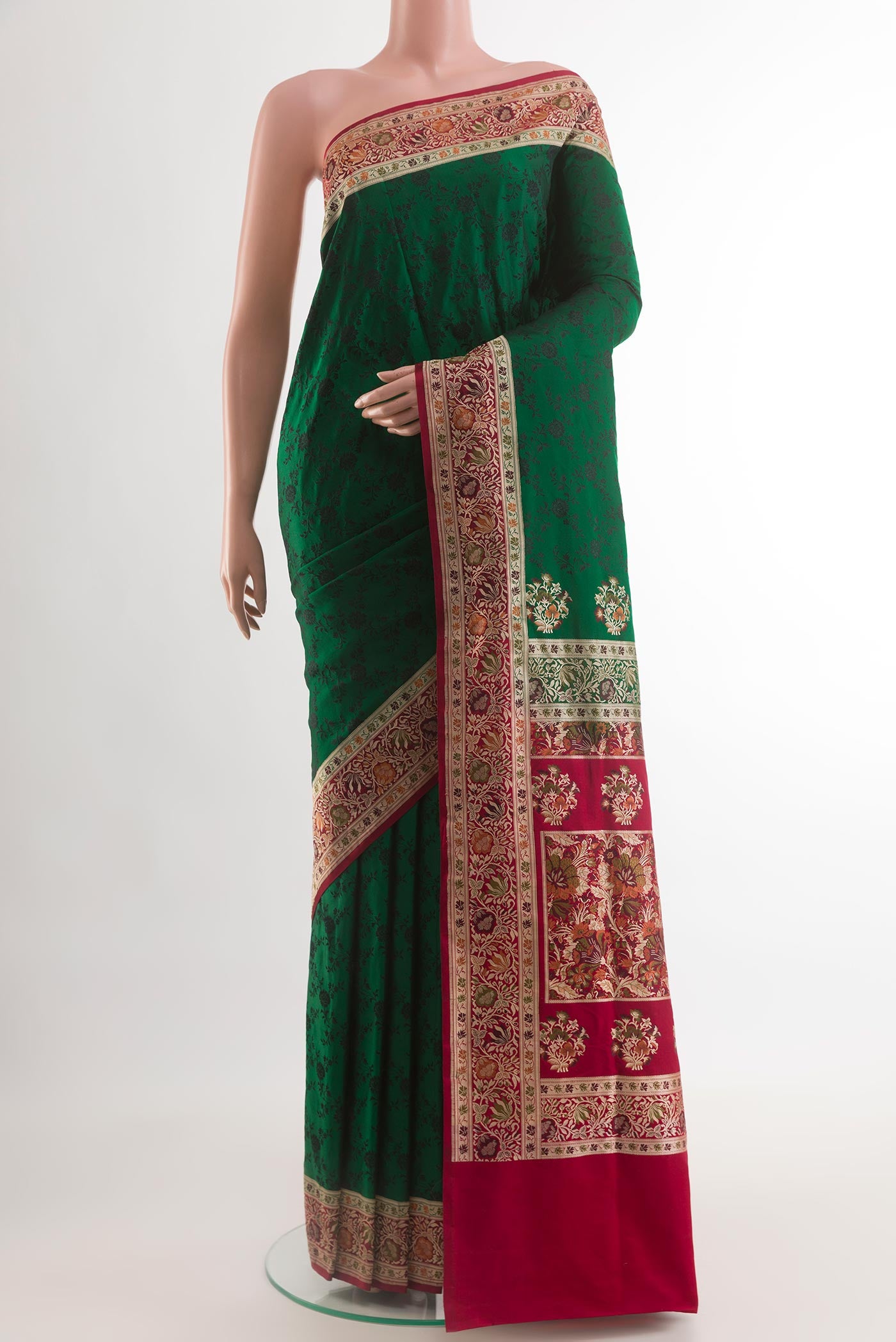 Green Banarasi Tanchoi Silk Saree with Jacquard design on the body and Zari And Thread Border.  displayed on a mannequin