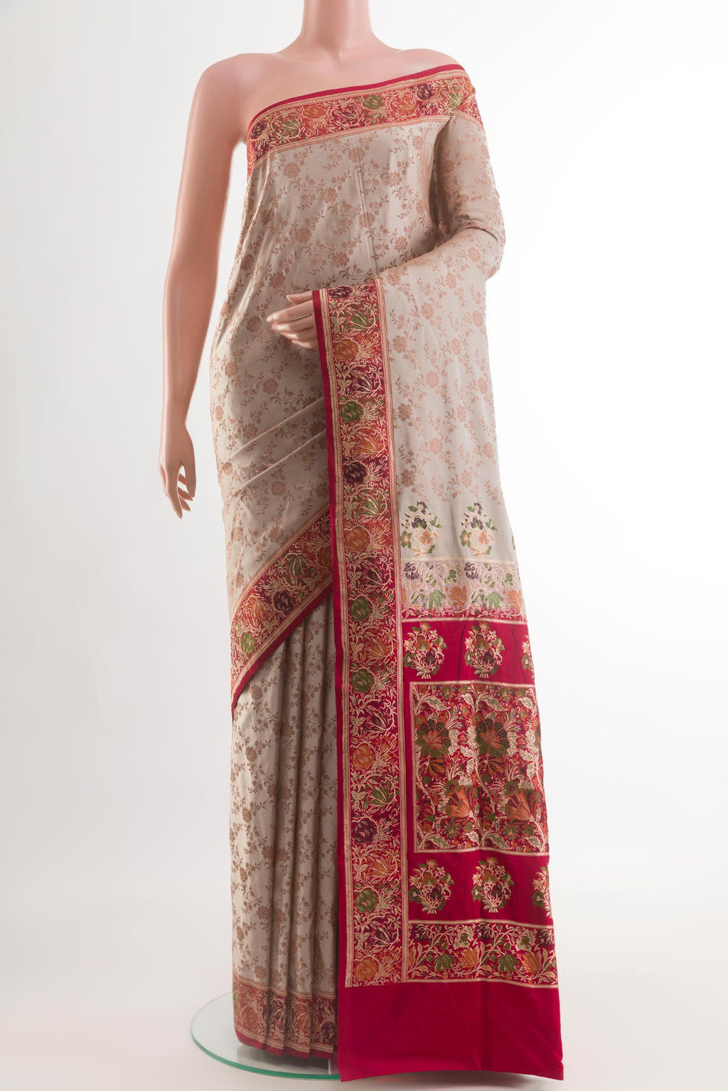 Beige Banarasi Tanchoi Silk Saree with Jacquard design on the body and Zari Border.  displayed on a mannequin