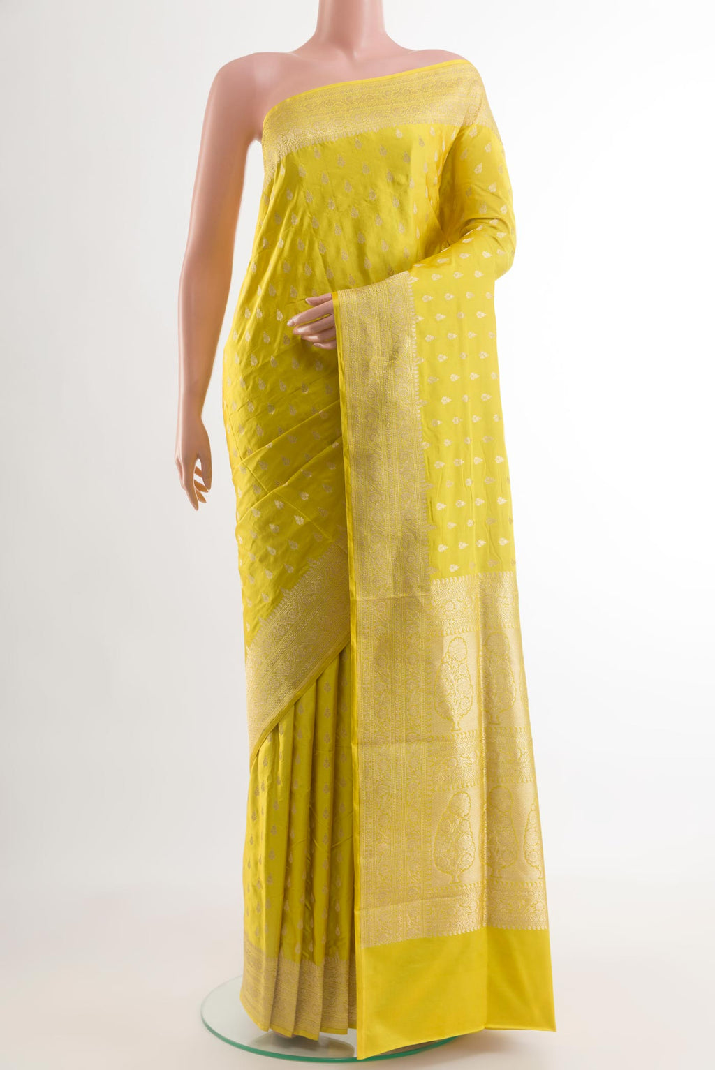 Yellow Banarasi Silk Saree with Zari Butta on the body and Zari Border.  displayed on a mannequin
