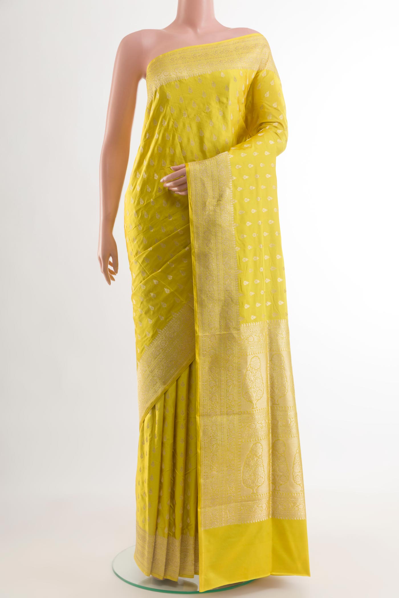 Yellow Banarasi Silk Saree with Zari Butta on the body and Zari Border.  displayed on a mannequin