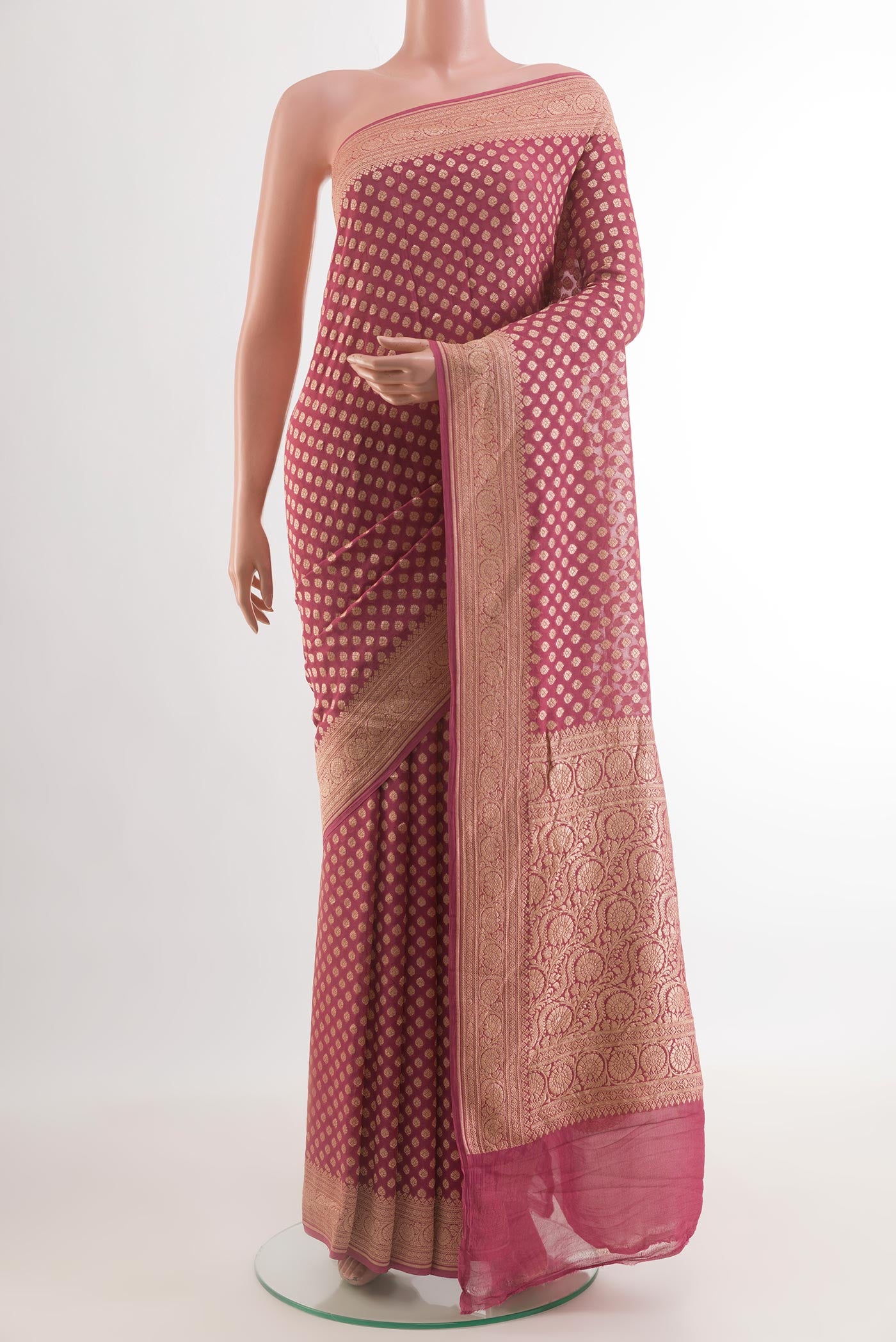 Mauve Banarasi Georgette Saree with Zari Butta on the body and Zari Border.  displayed on a mannequin