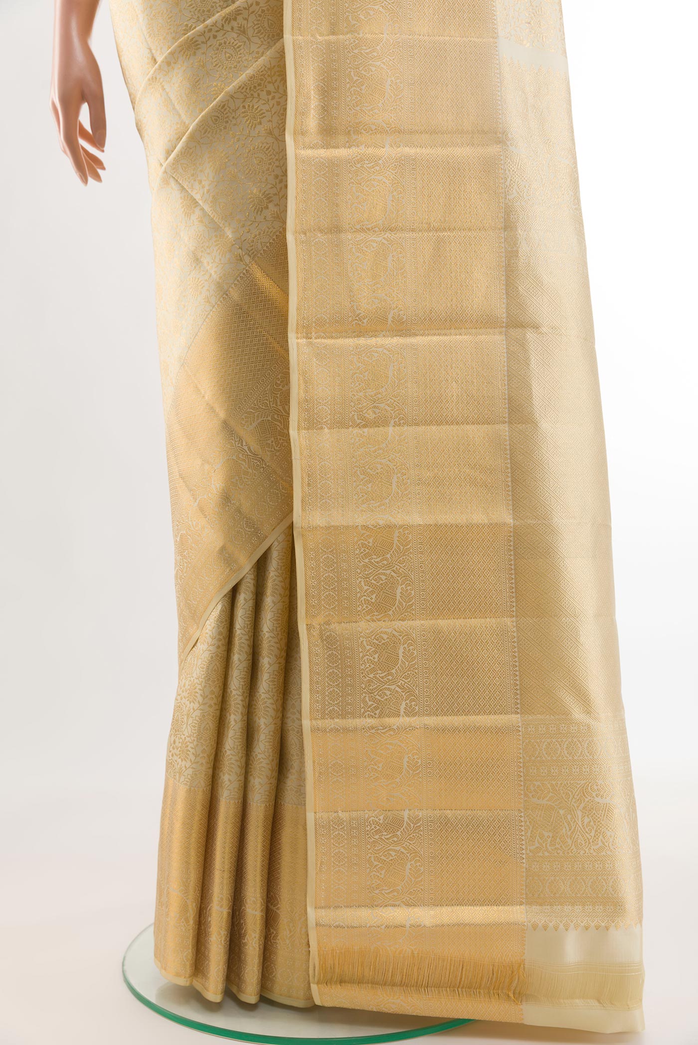 Pleats and pallu of Beige Kanchipuram Silk Saree with Zari Brocade on the body and Zari Border. 