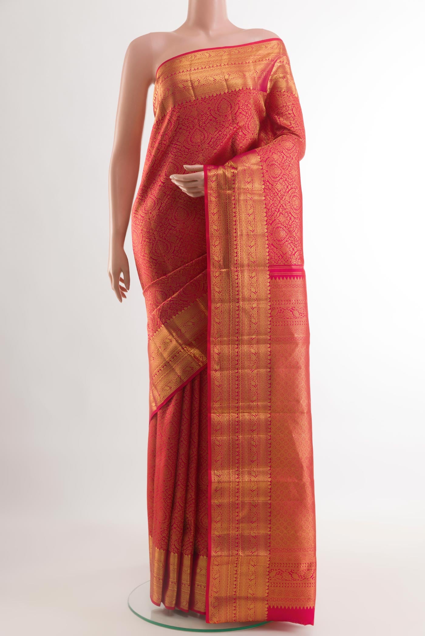 Red Kanchipuram Silk Saree with Zari Brocade on the body and Zari Border.  displayed on a mannequin