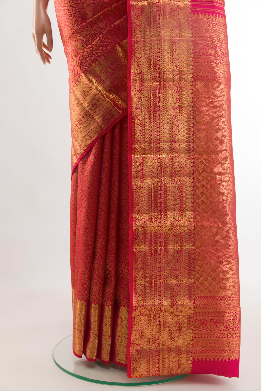 Pleats and pallu of Red Kanchipuram Silk Saree with Zari Brocade on the body and Zari Border. 