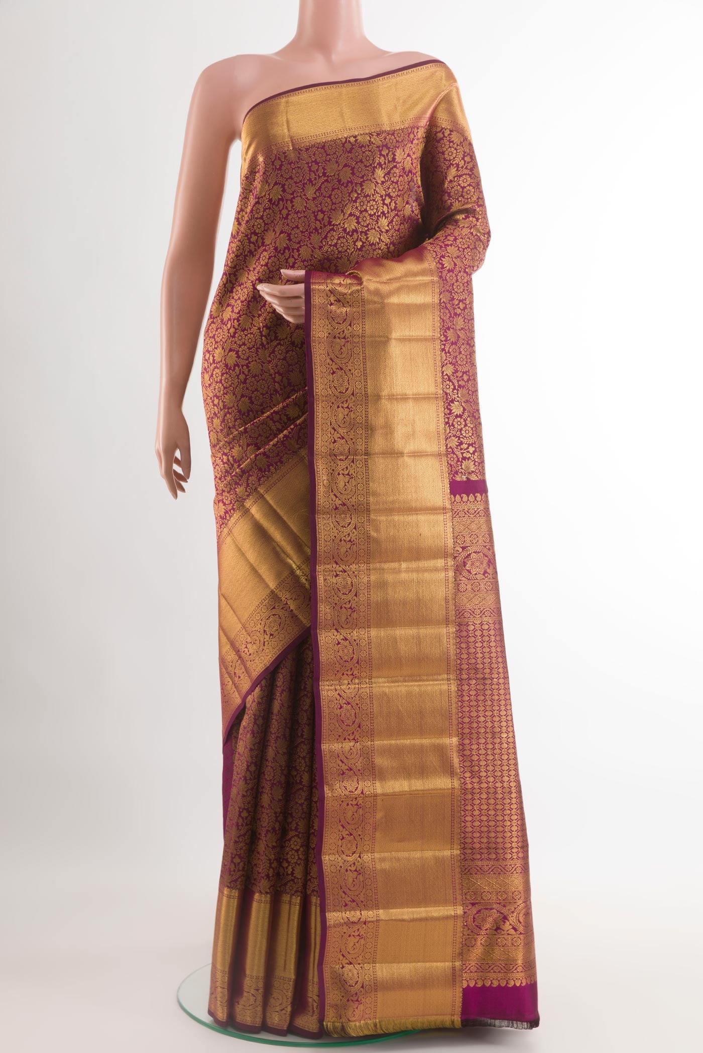 Purple Kanchipuram Silk Saree with Zari Brocade on the body and Zari Border.  displayed on a mannequin