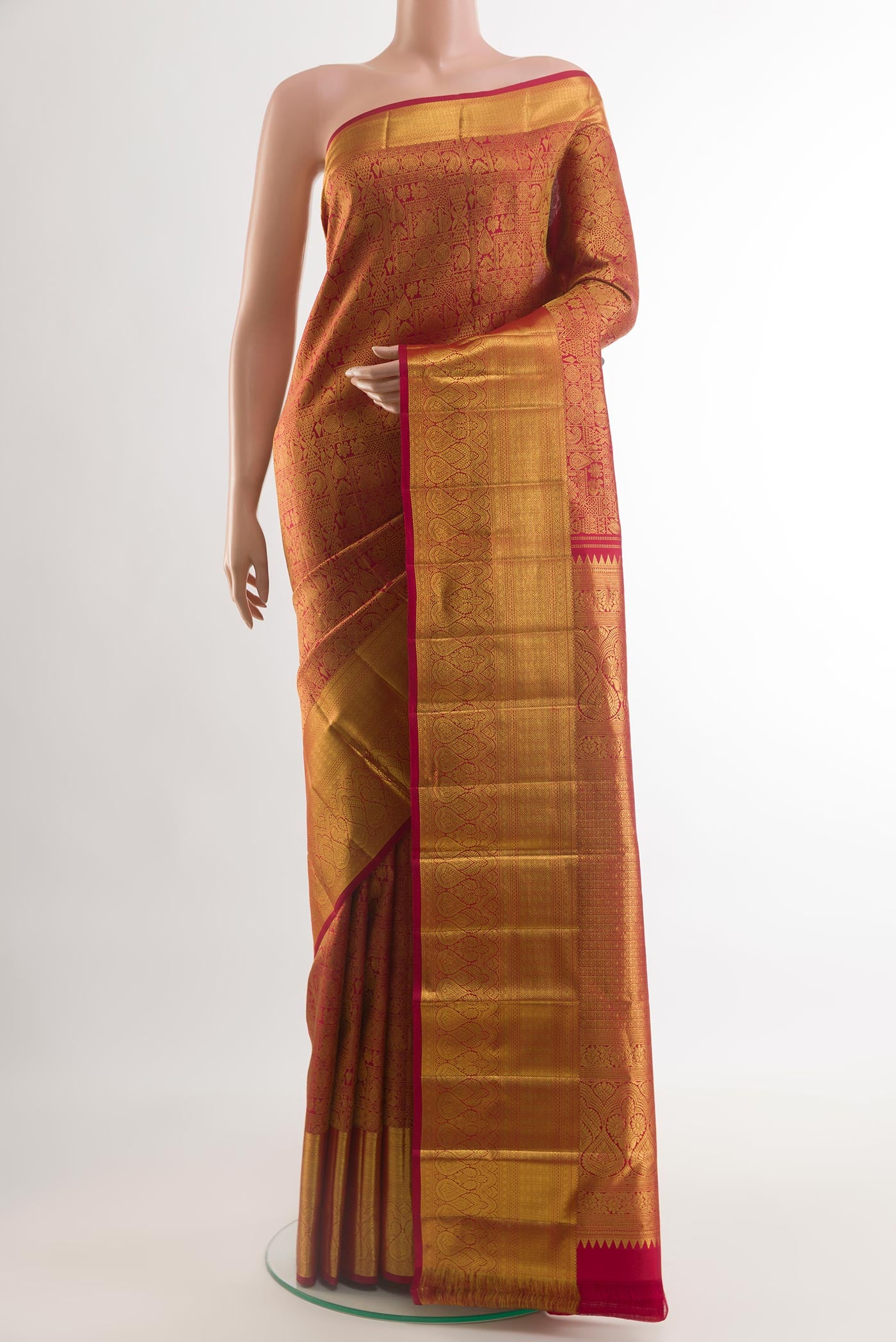 Red Kanchipuram Silk Saree with Zari Brocade on the body and Zari Border.  displayed on a mannequin