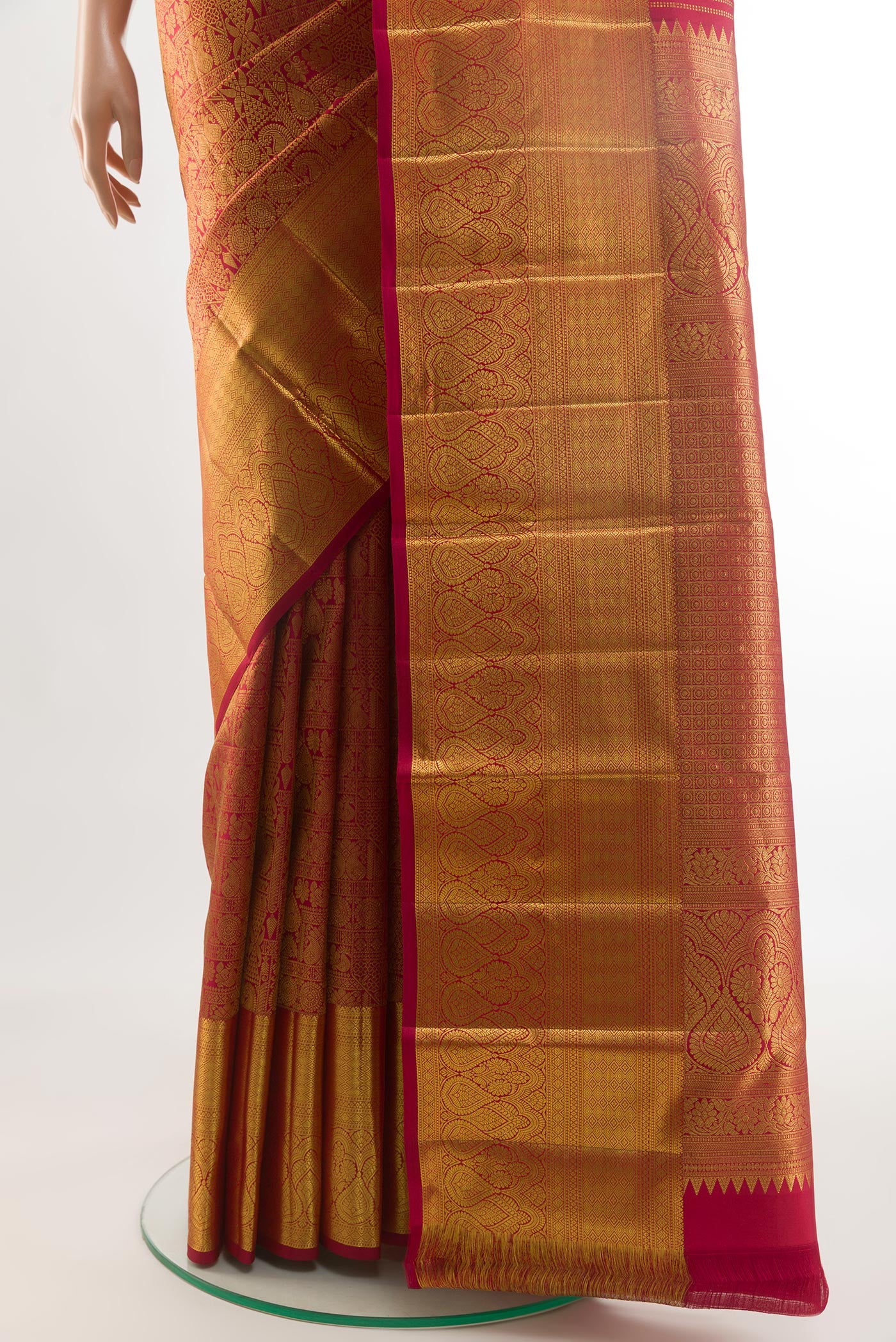 Pleats and pallu of Red Kanchipuram Silk Saree with Zari Brocade on the body and Zari Border. 