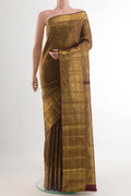 Black Kanchipuram Silk Saree with Zari Brocade on the body and Zari Border.  displayed on a mannequin