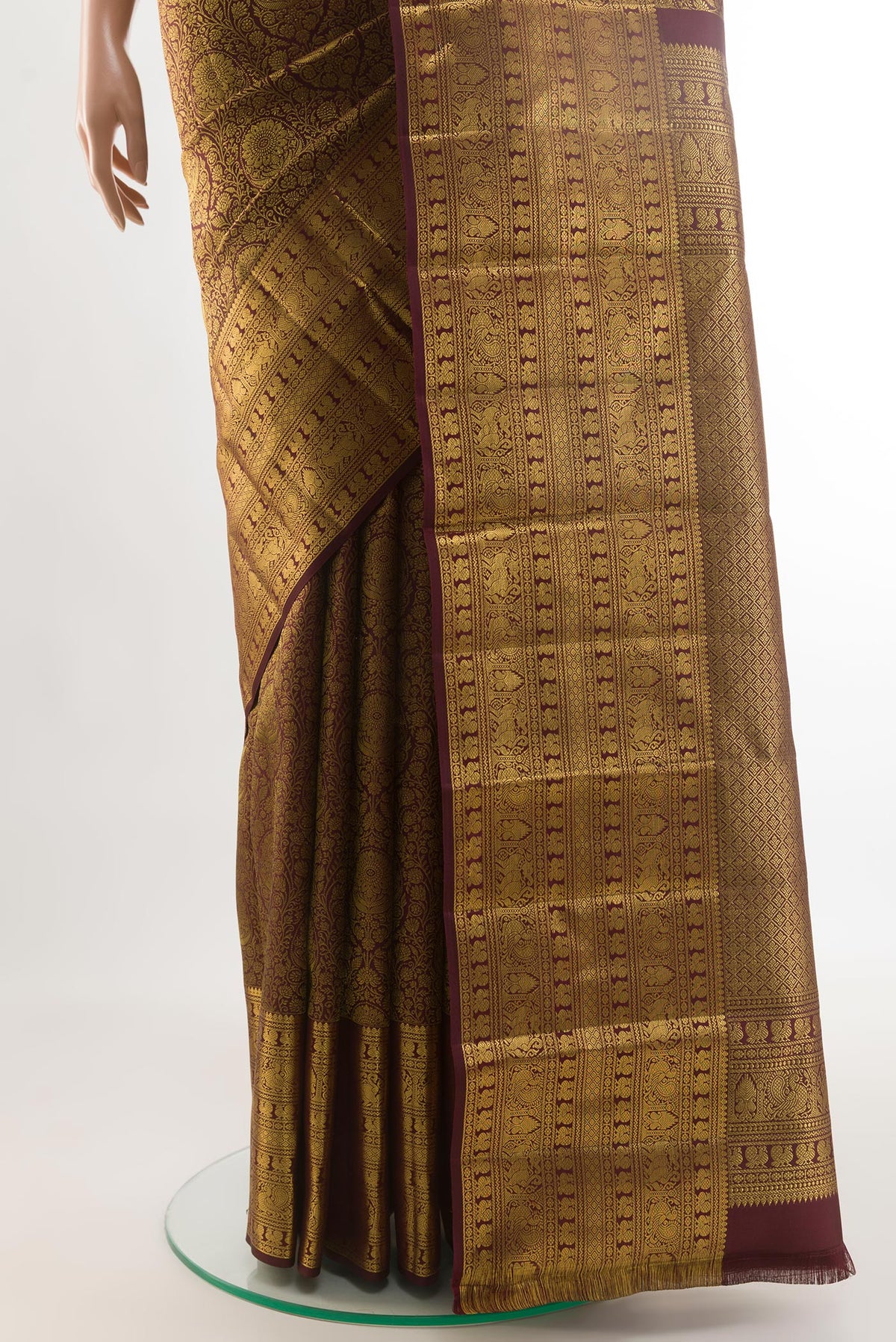 Pleats and pallu of Black Kanchipuram Silk Saree with Zari Brocade on the body and Zari Border. 
