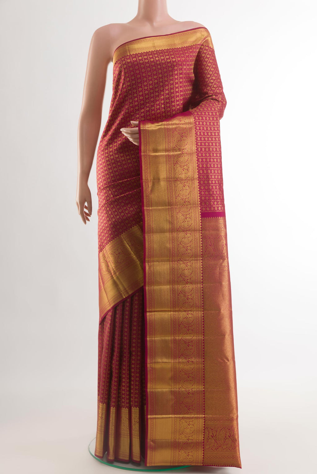 Maroon Kanchipuram Silk Saree with Zari Brocade on the body and Zari Border.  displayed on a mannequin
