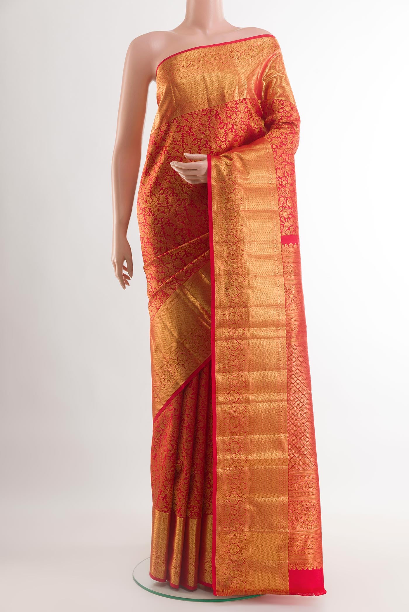 Red Kanchipuram Silk Saree with Zari Brocade on the body and Zari Border.  displayed on a mannequin