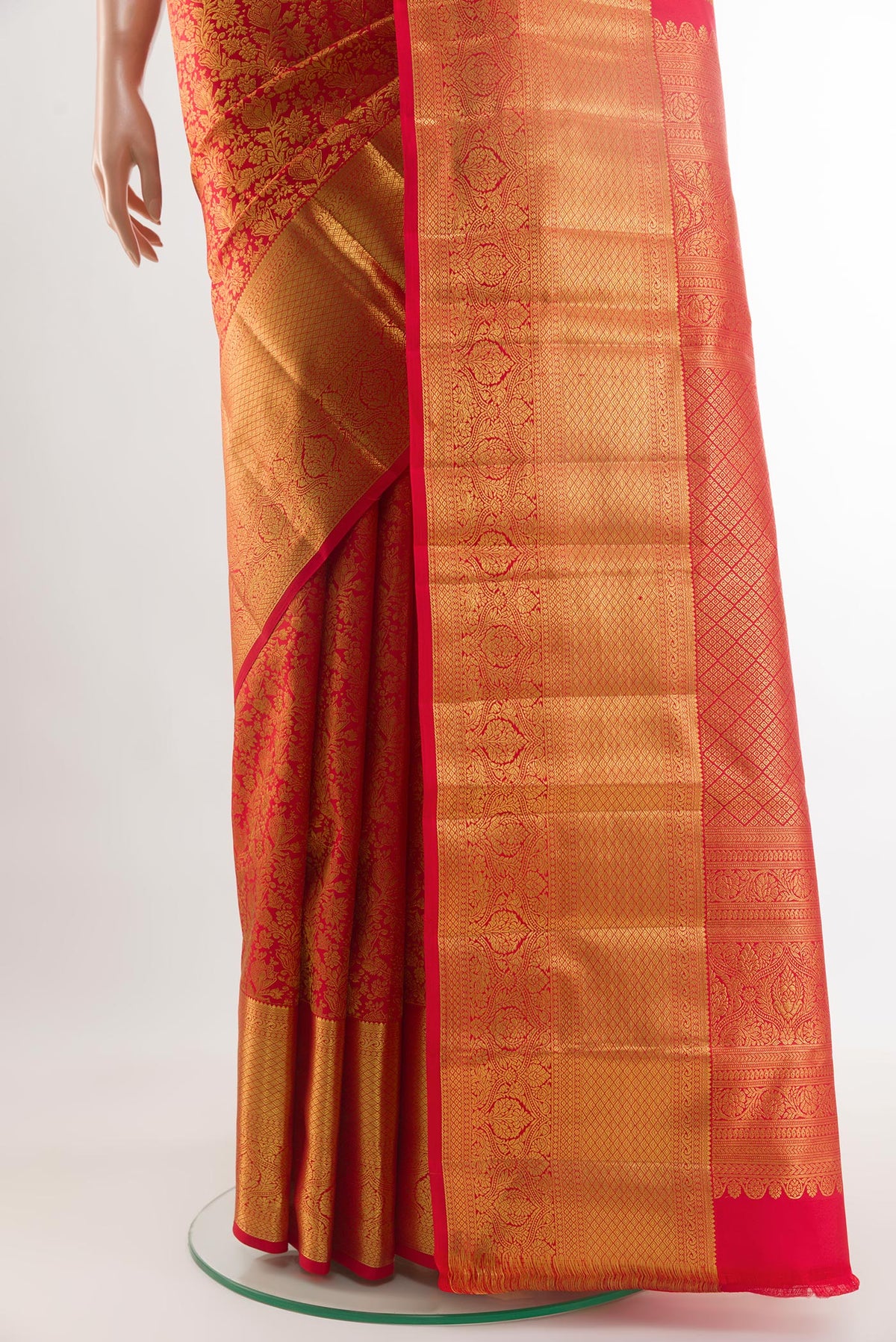 Pleats and pallu of Red Kanchipuram Silk Saree with Zari Brocade on the body and Zari Border. 