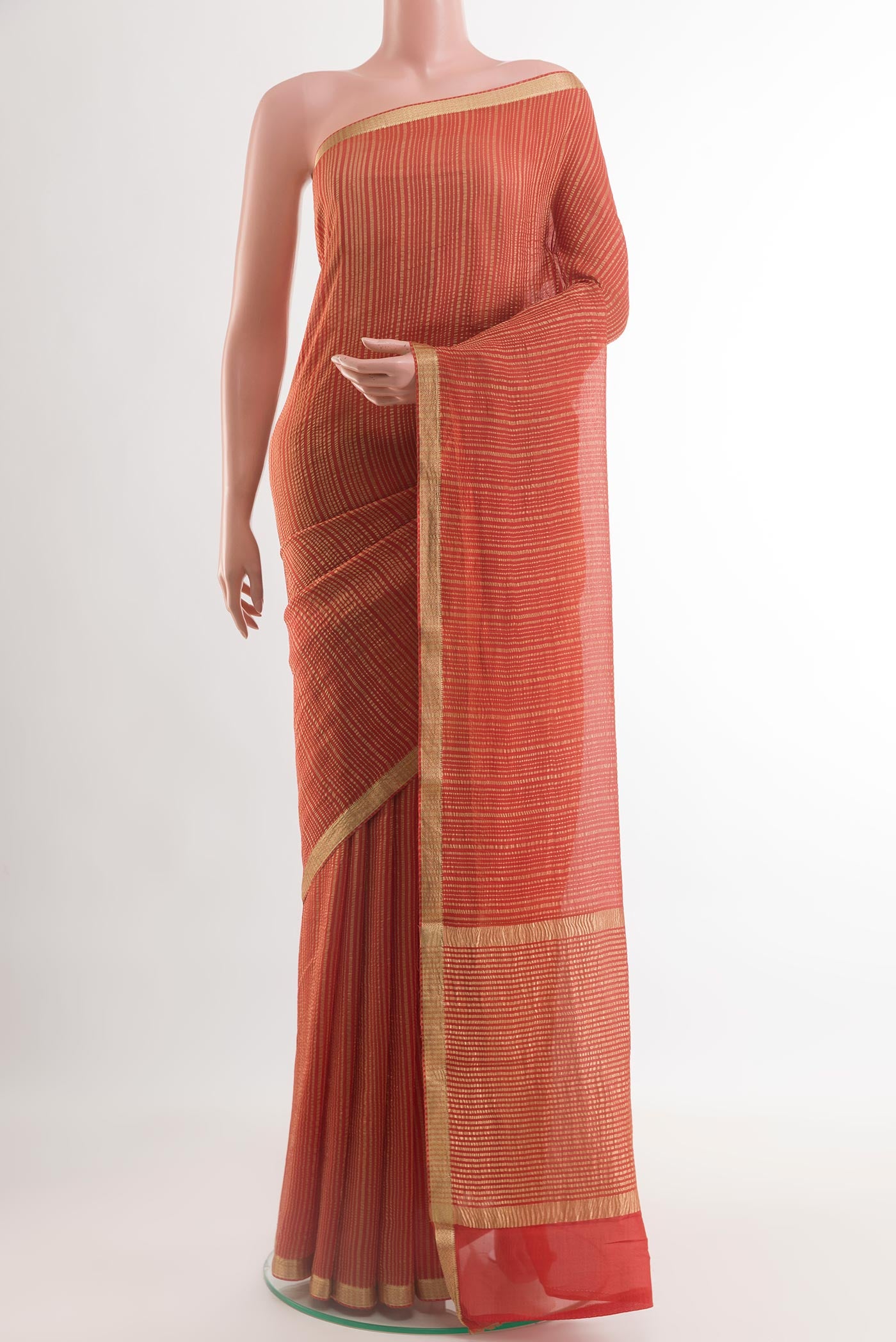 Orange Mysore Crepe Saree with Stripes on the body and Zari Border.  displayed on a mannequin