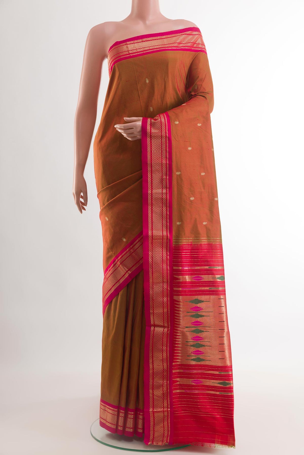 Rust Paithani Silk Saree with Zari Butta on the body and Zari Border.  displayed on a mannequin