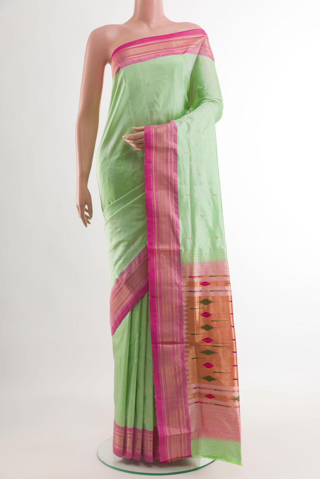 Mint Green Paithani Silk Saree with Zari Butta on the body and Zari Border.  displayed on a mannequin